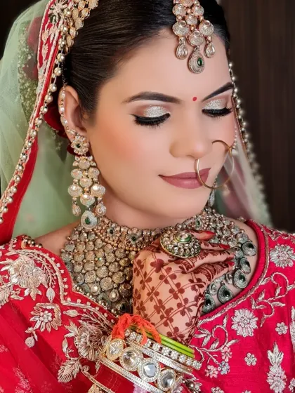 The 'Qaatil Look' for my bride. This close-up shows the silver glitter eyeshadow and nude-pink lipstick, a modern twist on a classic bridal look.