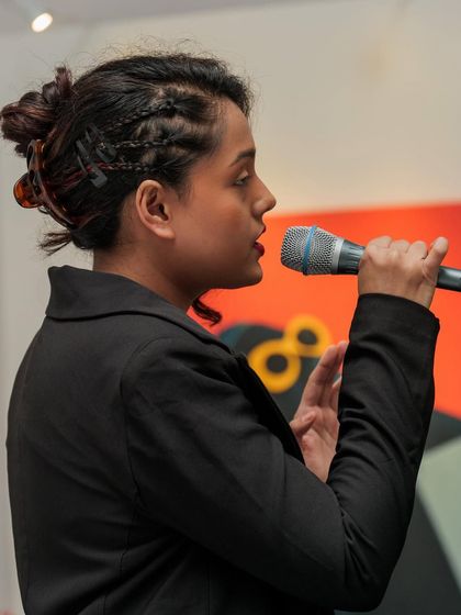 A profile shot from the Ajio Luxe Wkend, showing my braided hairstyle for the event. I always ensure my look is polished and appropriate for the occasion.