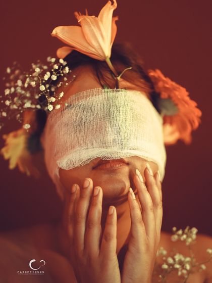 Another pose of emotional turmoil, as if trying to see through the blindfold. It's a powerful and evocative image.