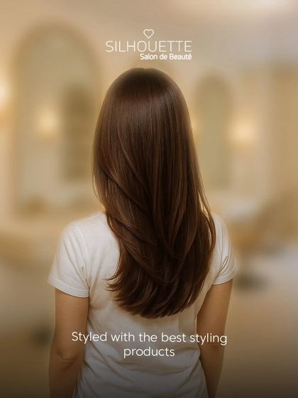 A beautiful example of our signature styling on long, layered hair. We use the best products to ensure a smooth, silky, and frizz-free finish.