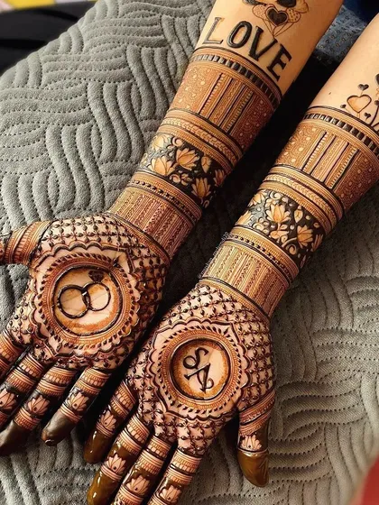 Your mehendi should tell your story. For this engagement, I incorporated the couple's initials and wedding ring motifs for a truly personal and memorable design.