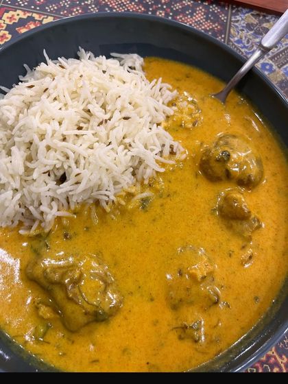 A delicious bowl of gatte ki sabji with jeera rice. This shows that even regional delicacies can be part of a balanced diet plan.