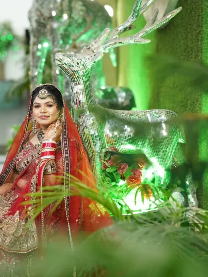 Another angle of the bride with the mirrored deer, showing a different expression and pose.