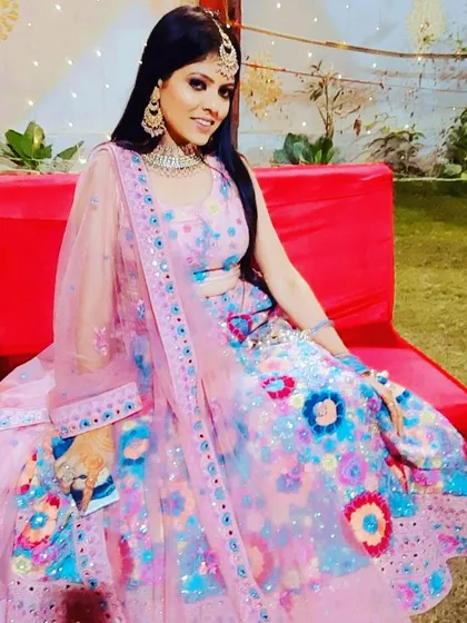 This client is sitting pretty in the colorful floral rental lehenga. It’s a comfortable and eye-catching choice for any celebration.