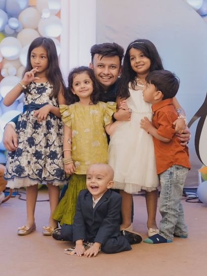 A precious group photo of the children at the Mundan ceremony. Even traditional events can be designed to be fun and engaging for the little ones.