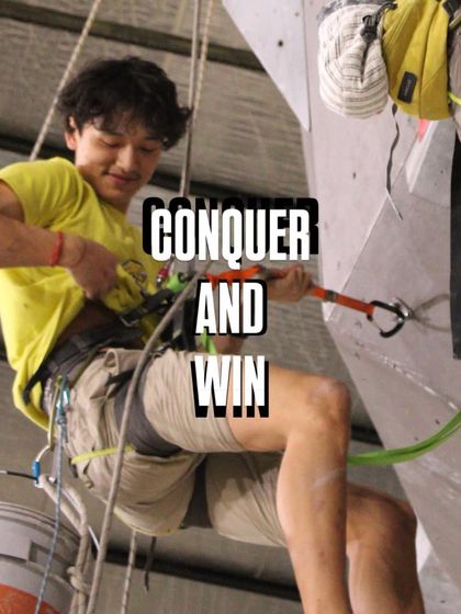 Our team member smiles while setting a new route. We love what we do, and that passion goes into every problem we create for you to conquer and win.