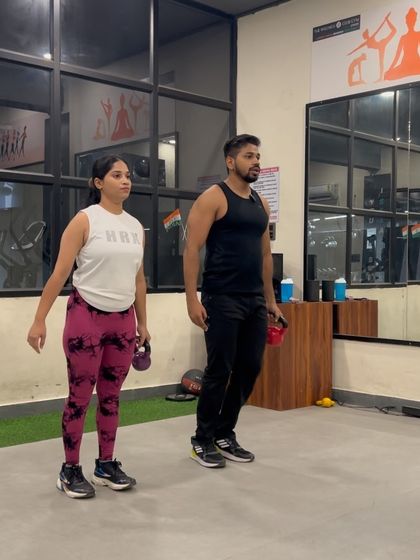 Part of our complete legs workout, this image shows a single-leg deadlift with a kettlebell, focusing on balance and posterior chain strength.