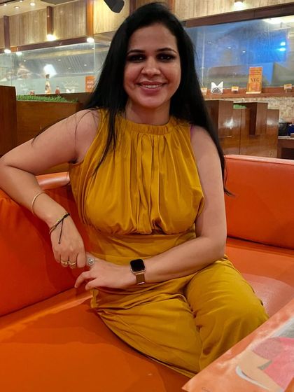 This mustard yellow satin jumpsuit is another one of my birthday outfits. The color is so vibrant and the fabric feels luxurious. It's a perfect statement piece for a special occasion.