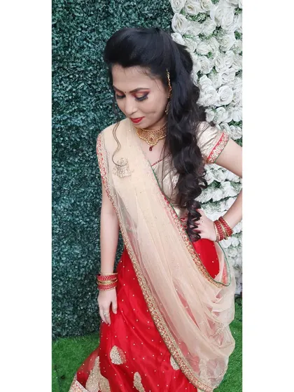 This shot shows the full effect of the lehenga and makeup. The side-swept hair adds a touch of modern glamour to the ensemble.