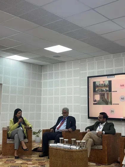 The panel discussion on the legal environment for technology transfer in progress, highlighting the collaborative nature of the symposium.
