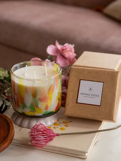This three-wick candle, with its vibrant splashes of color, makes a stunning statement piece. Poured with our Jasmine Patchouli soy wax blend, it comes in our signature gift box, ready to be presented as a thoughtful gift.