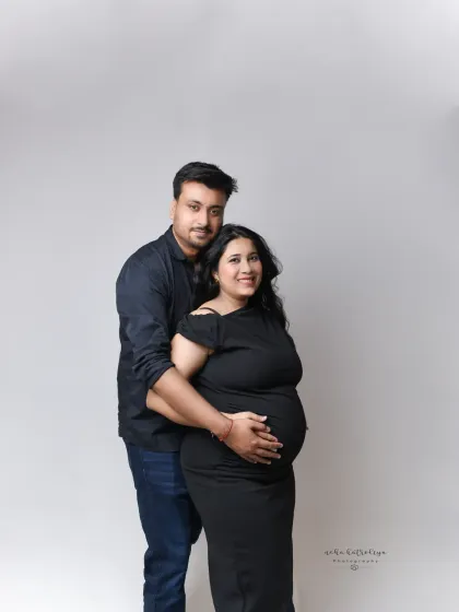 The same pose against a simple white background gives the photo a completely different feel. This bright and airy style is clean and modern, keeping the focus entirely on the couple's happy expressions.