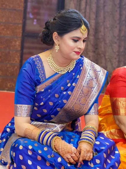 A candid moment during the ceremony. Her makeup looks perfect from every angle.
