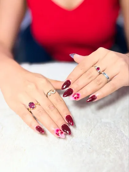 A beautiful floral design on a deep maroon base. Learning to paint delicate flowers on dark colors is a technique that requires good opacity and control.
