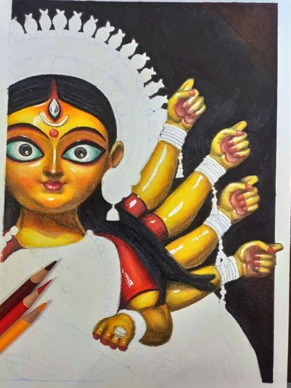 A progress shot of the Durga Maa drawing. Here you can see the face and arms are colored, while the sari and crown are still in the line art stage.