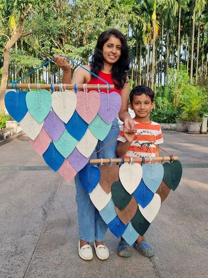 Even our nephew wants to join the photoshoot. Accent wall decor like these macrame leaf hangings can instantly transform a room and change the vibe of your whole house.