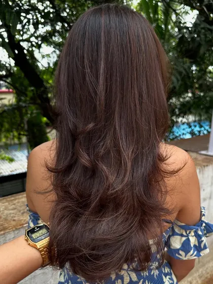 Sometimes all you need is a color refresh and a good haircut. I touched up her roots, toned her existing highlights, and gave her a fresh layered cut to bring her hair back to life.