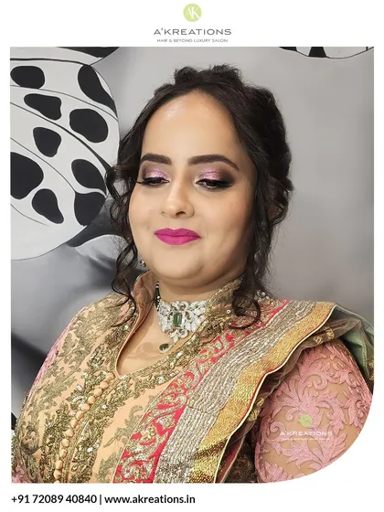 A slightly different angle capturing the beautiful details of the traditional attire and how the makeup complements the outfit's colors.
