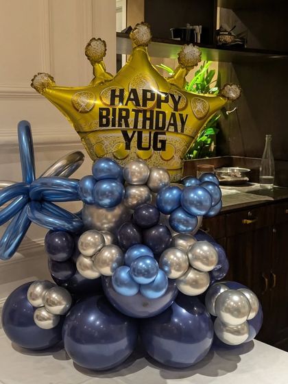This custom balloon centerpiece is perfect as a standalone gift or as a decoration for a cake table.