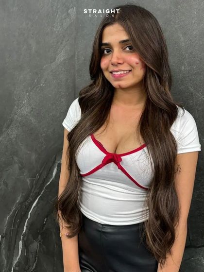 A full portrait of the client, her hair styled to perfection.