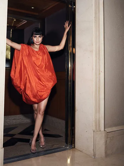 The full effect of the archival sculpted dress, showing how it creates a unique and powerful silhouette.