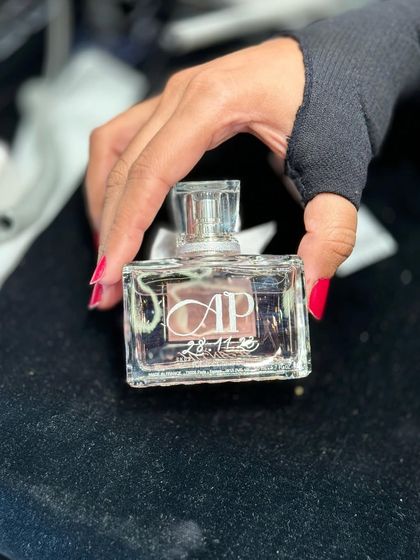 A glimpse from my Diwali onsite event with Dior, showing a personalized perfume bottle held in hand. The work continues even with henna-adorned hands.