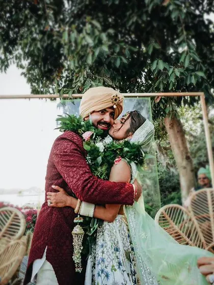 The jaimala is more than a ritual; it's a moment of pure joy. We love creating the perfect backdrop for these memories, where the couple's happiness is the true centerpiece of our design. This candid moment captures the love and laughter that we strive to inspire.