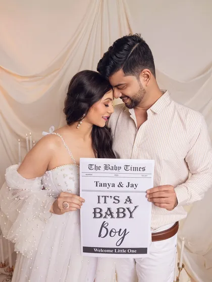 Let's announce your news in style. I help couples design creative gender reveals, like this custom "The Baby Times" newspaper prop, making the announcement a fun and memorable part of your pregnancy photoshoot.