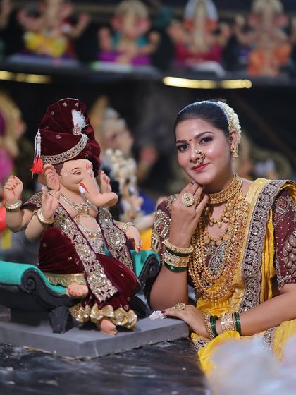 A close-up with Bappa, highlighting the detailed temple jewellery and the traditional Maharashtrian nath.