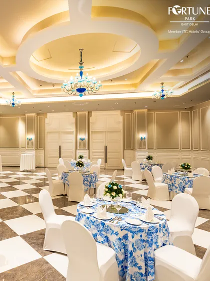 I believe every grand celebration deserves a breathtaking setting. My main banquet hall, with its magnificent chandeliers and classic checkered flooring, provides a truly elegant canvas for your most important life events, from weddings to milestone anniversaries.