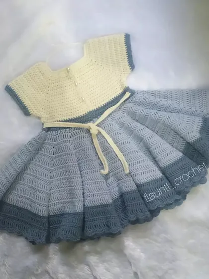 This custom princess frock was made for a little one's second birthday. I used a soft cotton blend yarn to create its full, twirly skirt, which has a flare of over 190 inches. It’s a piece designed for making beautiful memories.