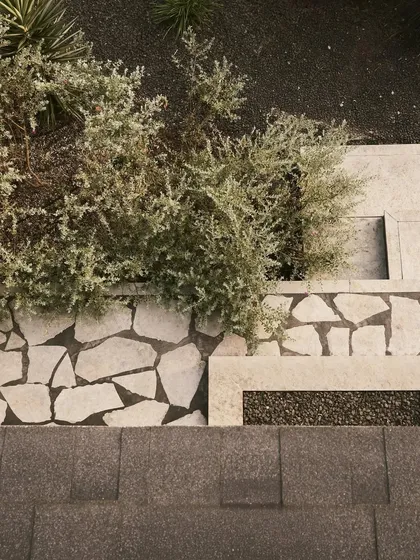 The landscape design for Pavilion House features local flagstones and arid-climate plants. This detail shows our commitment to creating designs that are sensitive to the context and celebrate the natural beauty of the site.