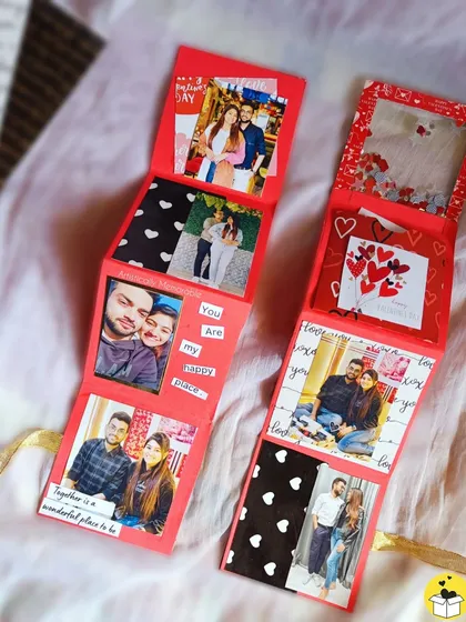 A look at a red zig-zag or accordion-style mini album, which unfolds to reveal a story.