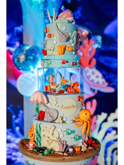 Another angle of the incredible ocean-themed birthday cake, showcasing the detailed craftsmanship and vibrant colors that make it a showstopper.