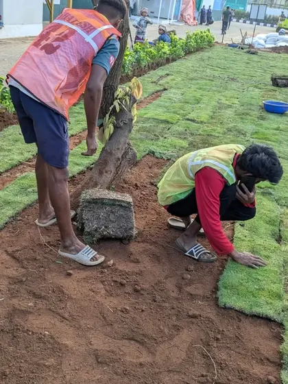 A close up of our team member carefully laying down a section of turf. Precision is key to avoiding gaps and ensuring the lawn looks perfect.