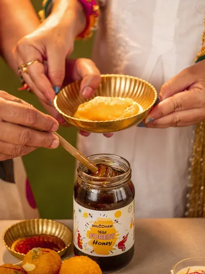 A close-up shot from our Holi project, highlighting the product (wild forest honey) being used with traditional sweets. This shows how to create a natural product placement.