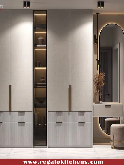 We create wardrobes that do more than just store clothes. This design seamlessly integrates a full vanity station with an illuminated mirror, providing a dedicated space for your morning routine without sacrificing style or storage.