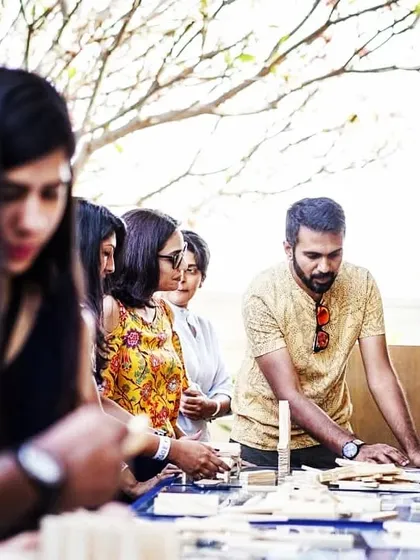 We bring the entire experience to you, whether it's your office or an off-site location. Our facilitators are there to guide the process, introduce challenges, and ensure everyone is engaged. Here you can see us helping a team get started on their collaborative build.