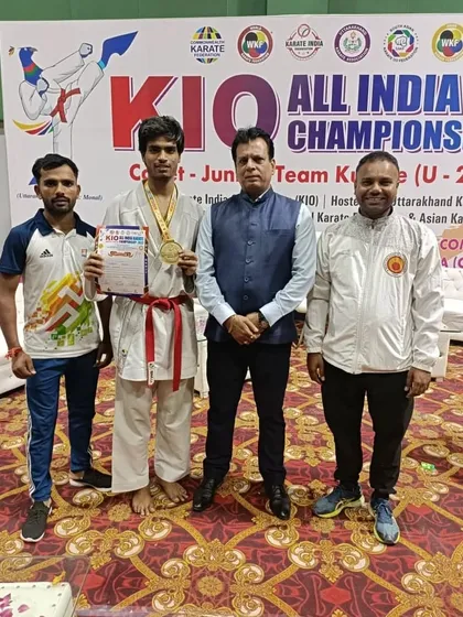 Posing with officials and Hanshi Bharat Sharma ji, Harshit holds his gold medal and certificate from the All India Championship.