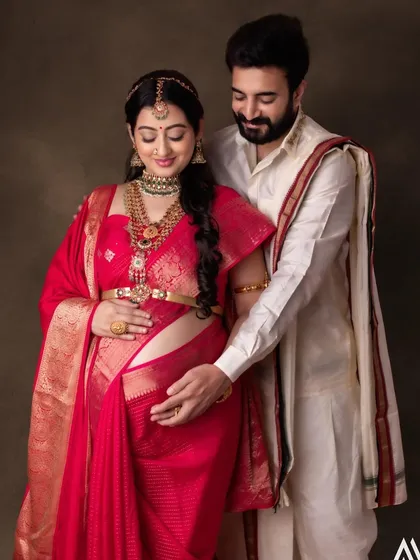 A beautiful moment between the parents-to-be. The makeup is soft and radiant, celebrating this special time.