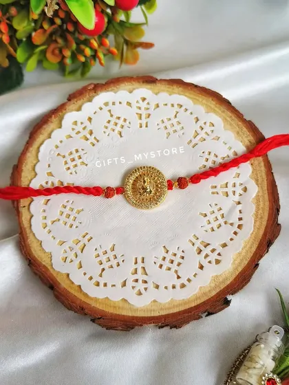A simple yet powerful Rakhi featuring a golden lion emblem, for the brother who is your protector.