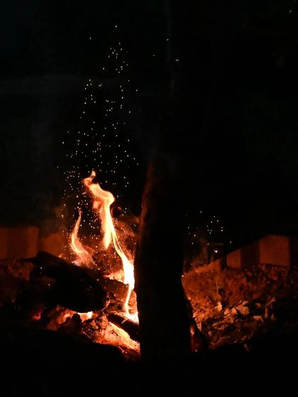 The warmth of a campfire during our coastal trip.