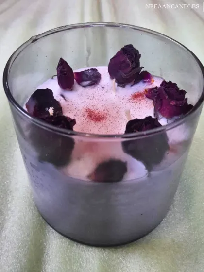 Elegance in every flame. This beautiful glass jar candle is infused with real dried rose buds, bringing calm, charm, and cozy vibes to any corner.