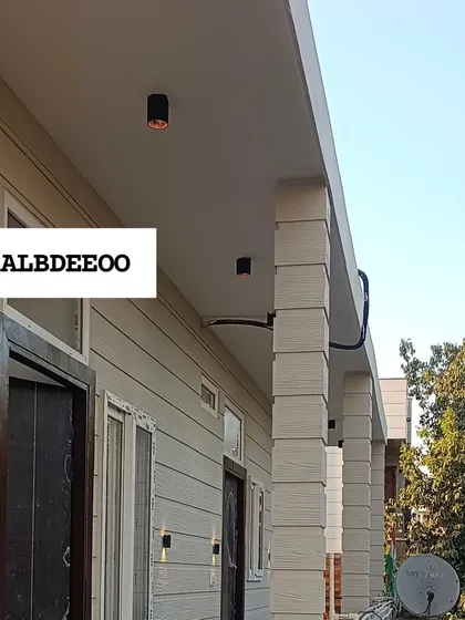 A series of detailed shots of a terrace prefab house's exterior. These images focus on the wood-textured cement plank elevation, modern ceiling lights, and high-quality VEKA window frames.