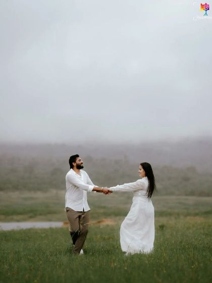 A portrait capturing the couple dancing in a misty field, their movement and connection creating a beautifully romantic scene.