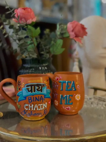 Our quirky terracotta chai mugs styled on a serving tray, ready for a fun tea party.