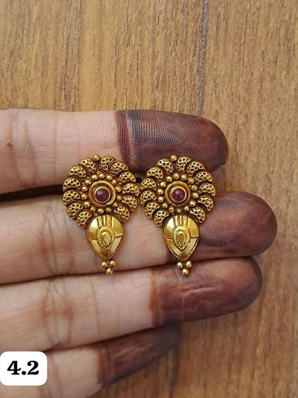These small floral antique gold-plated earrings are perfect for daily wear. The intricate design adds a touch of elegance to your look.