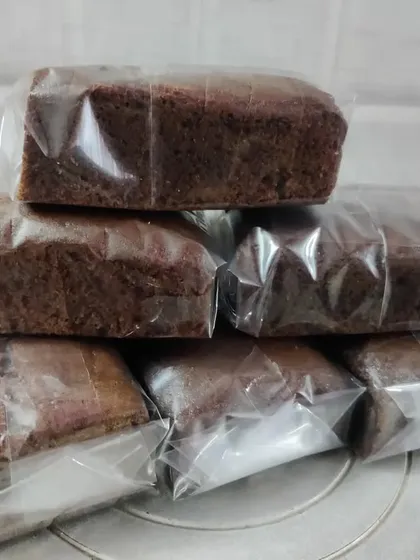 A stack of my chocolate loaf cakes, all sliced and wrapped. They are perfect for when you need a simple, delicious, and shareable dessert.