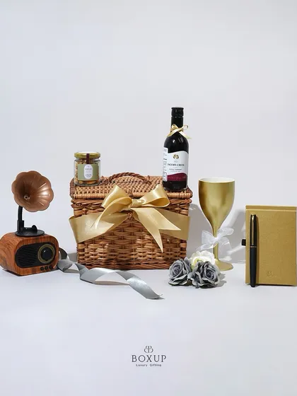 The 'Vintage Dreams' hamper is perfect for impressing clients or colleagues, featuring a classic wicker basket and a selection of sophisticated gifts.