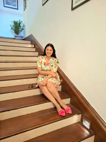 A relaxed moment on the stairs. The vibrant print and easy silhouette make this dress a go-to for effortless style.